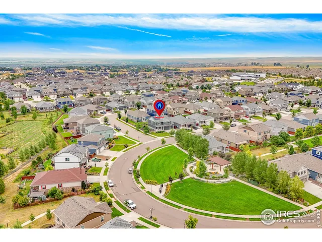 an aerial view of a residential houses with outdoor space
