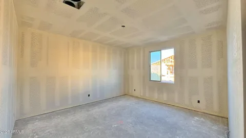 an empty room with a empty space and windows