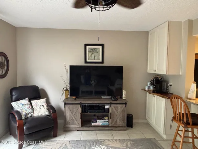 a living room with furniture and a lamp