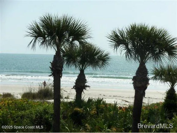 a dining room with furniture and chandelier