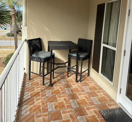 a living room with a rug and a rug