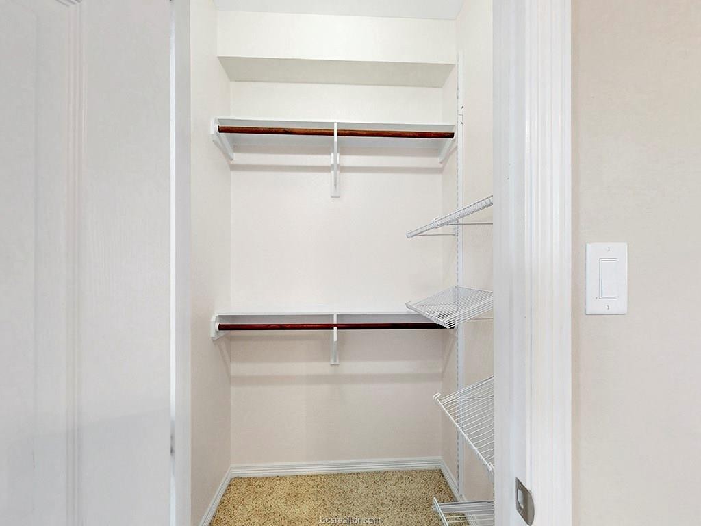 1198 Jones-Butler Road, Unit 2607 College Station, TX 77840 - Photo 12 of 26 a view of walk in closet with empty racks
