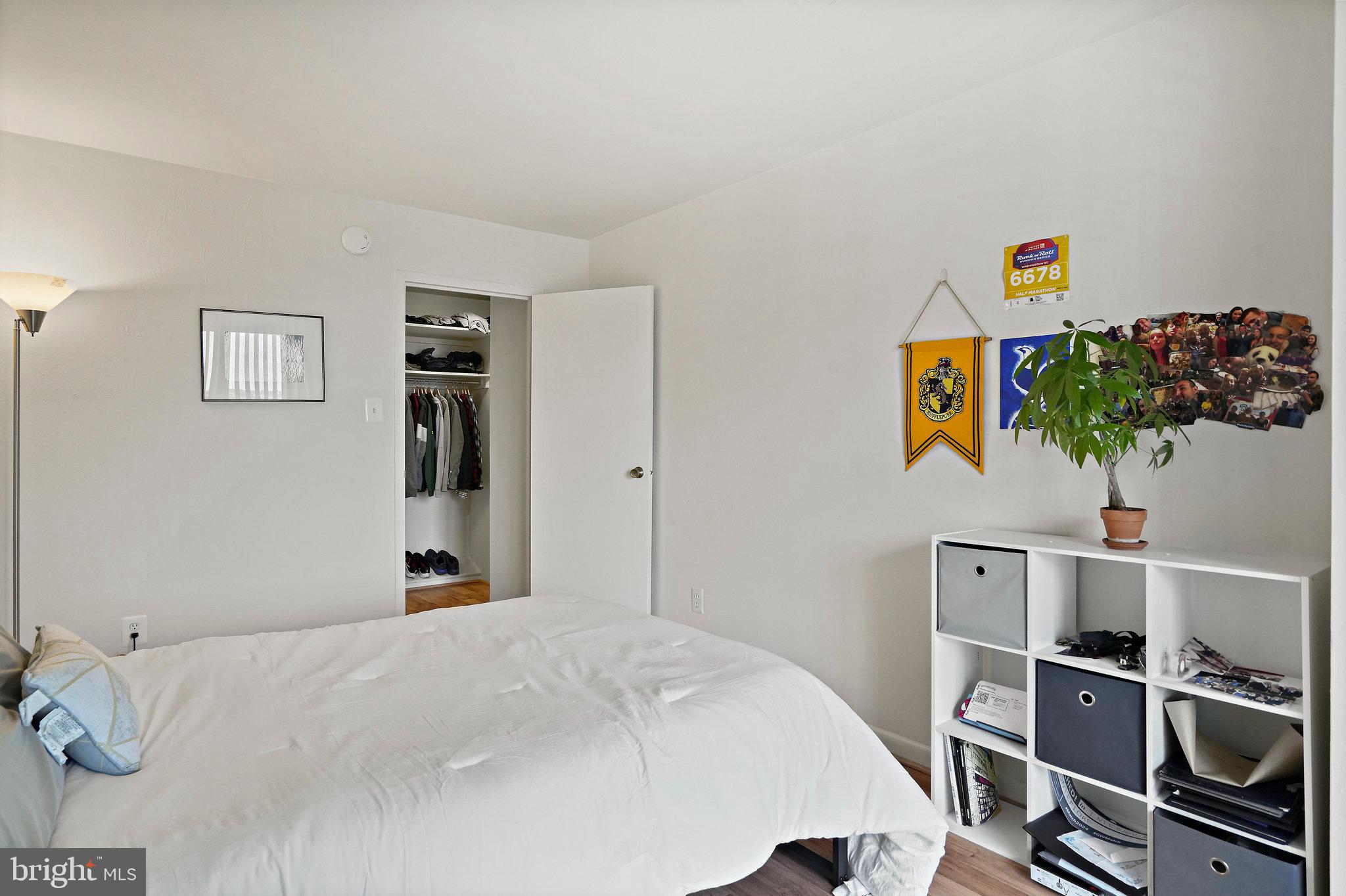 950 25th Street Northwest, Unit 1027N Washington, DC 20037 - Photo 22 of 32 a bedroom with a bed and book shelf
