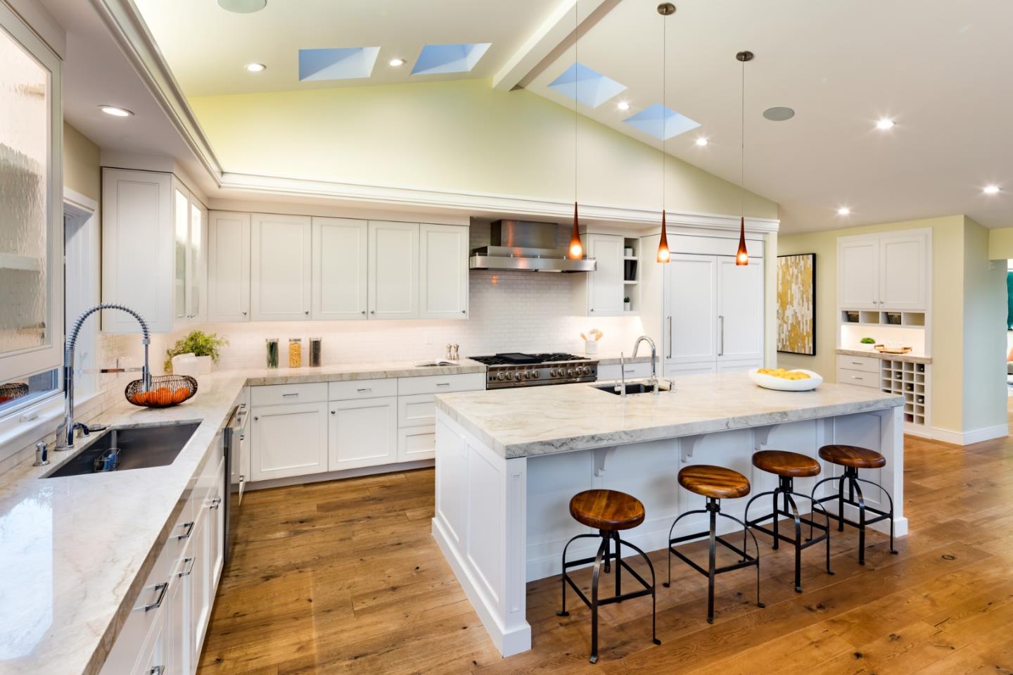 631 La Mesa Drive Portola Valley, CA 94028 - Photo 13 of 27 a kitchen with a sink a stove and chairs