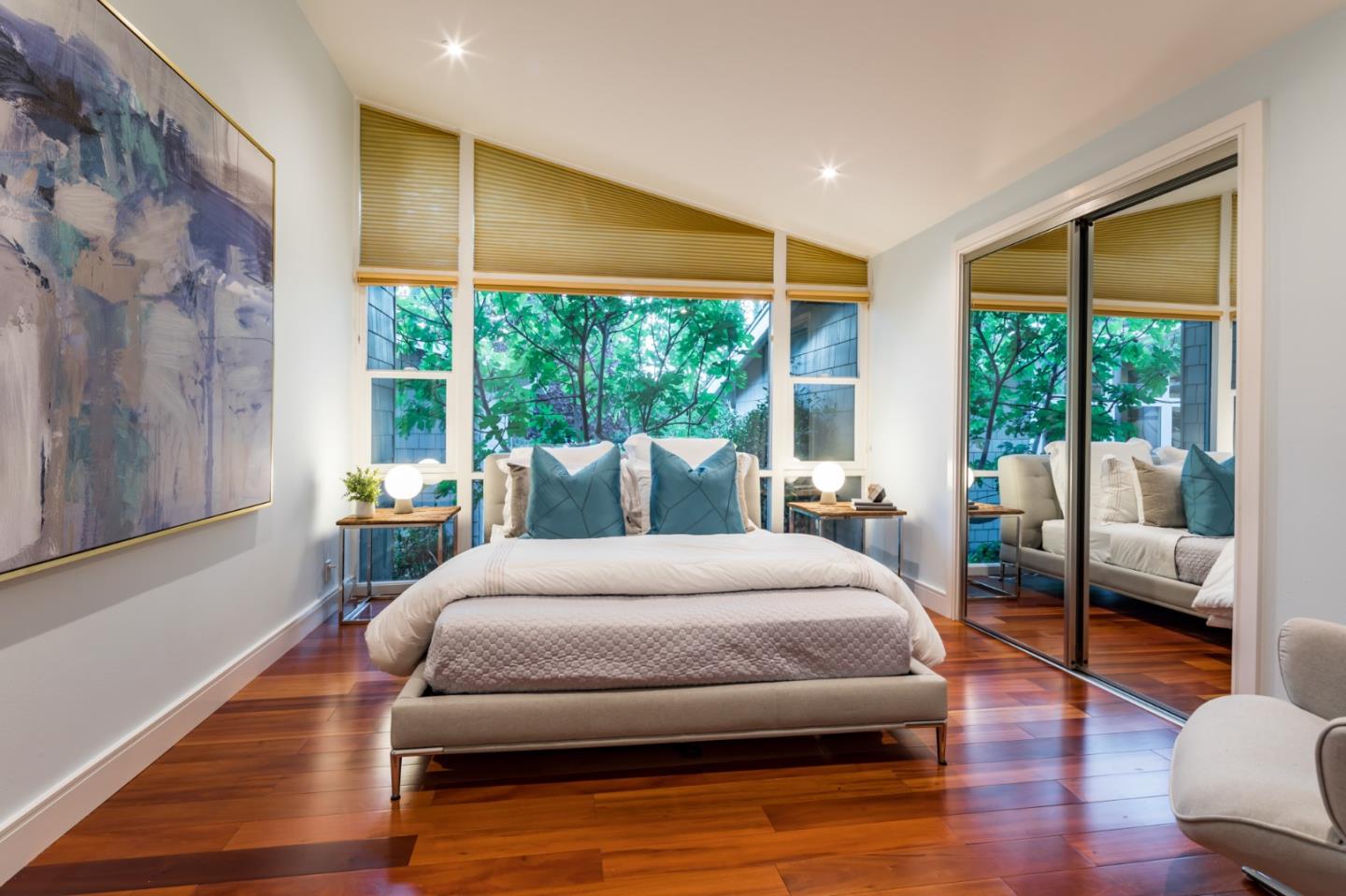 631 La Mesa Drive Portola Valley, CA 94028 - Photo 16 of 27 a bedroom with a bed and wooden floor