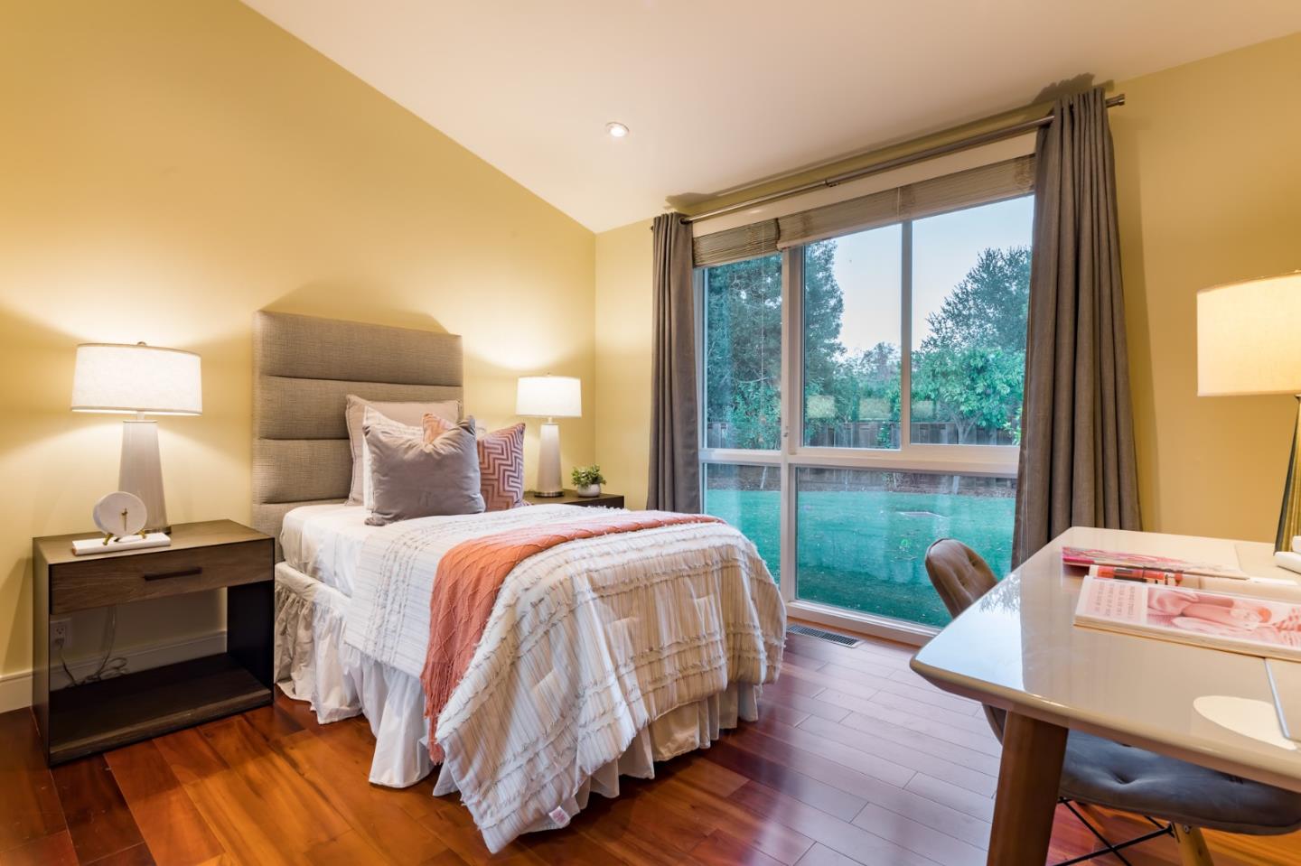 631 La Mesa Drive Portola Valley, CA 94028 - Photo 18 of 27 a bedroom with a bed and a table