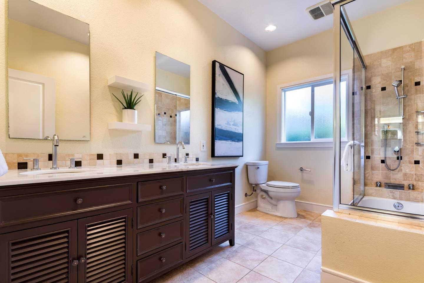 631 La Mesa Drive Portola Valley, CA 94028 - Photo 19 of 27 a bathroom with a double vanity sink a toilet and a mirror
