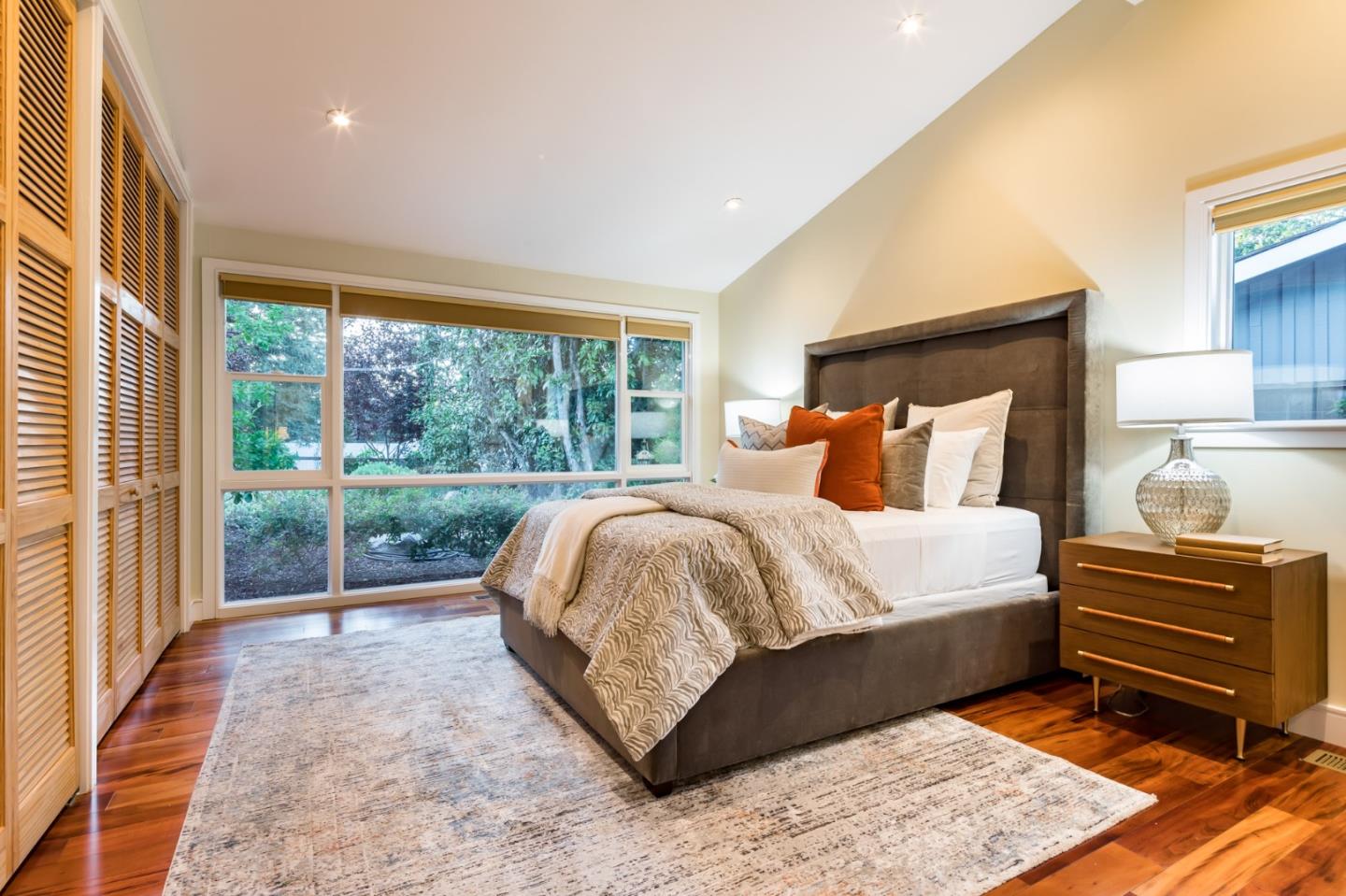 631 La Mesa Drive Portola Valley, CA 94028 - Photo 20 of 27 a bed sitting in a bedroom next to a window