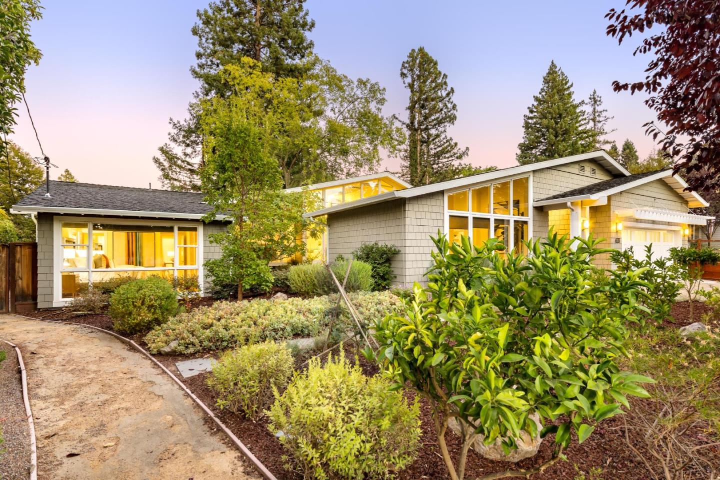 631 La Mesa Drive Portola Valley, CA 94028 - Photo 2 of 27 a front view of a house with a yard garage and outdoor seating