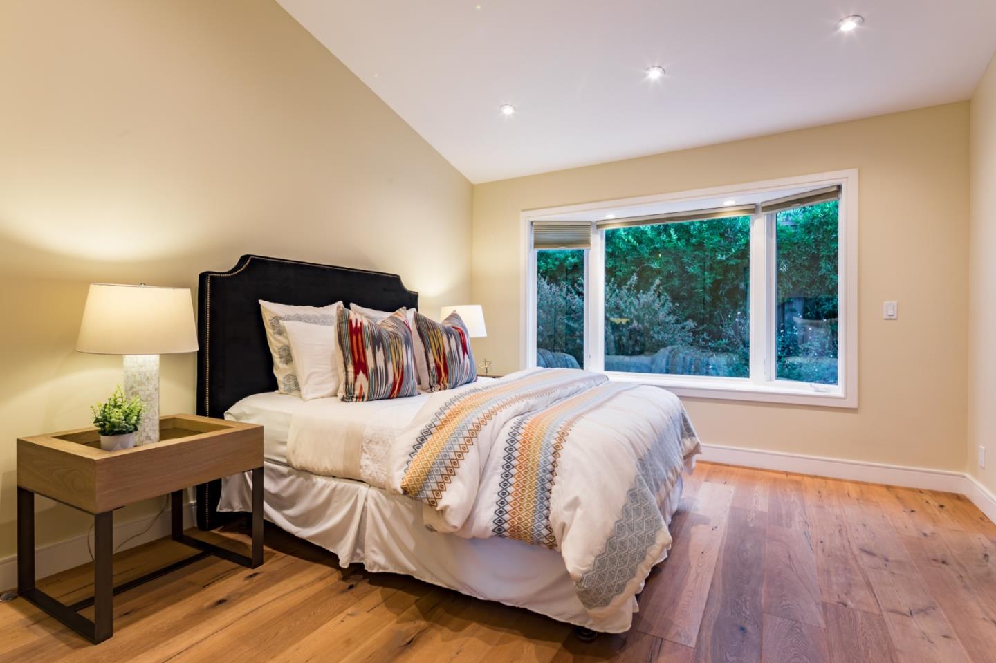 631 La Mesa Drive Portola Valley, CA 94028 - Photo 8 of 27 a bedroom with a bed and wooden floor