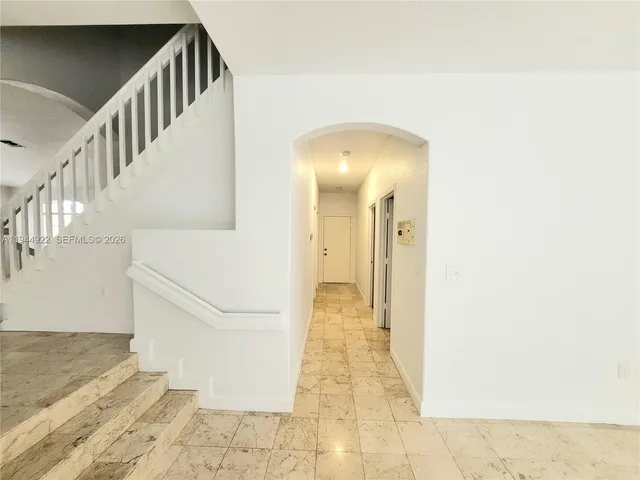 a view of a hallway with staircase