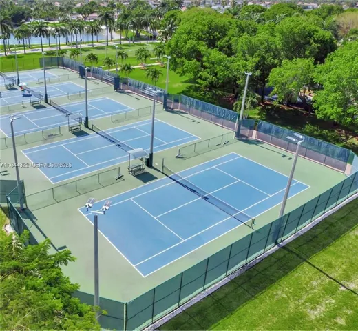 a view of an outdoor space and tennis court