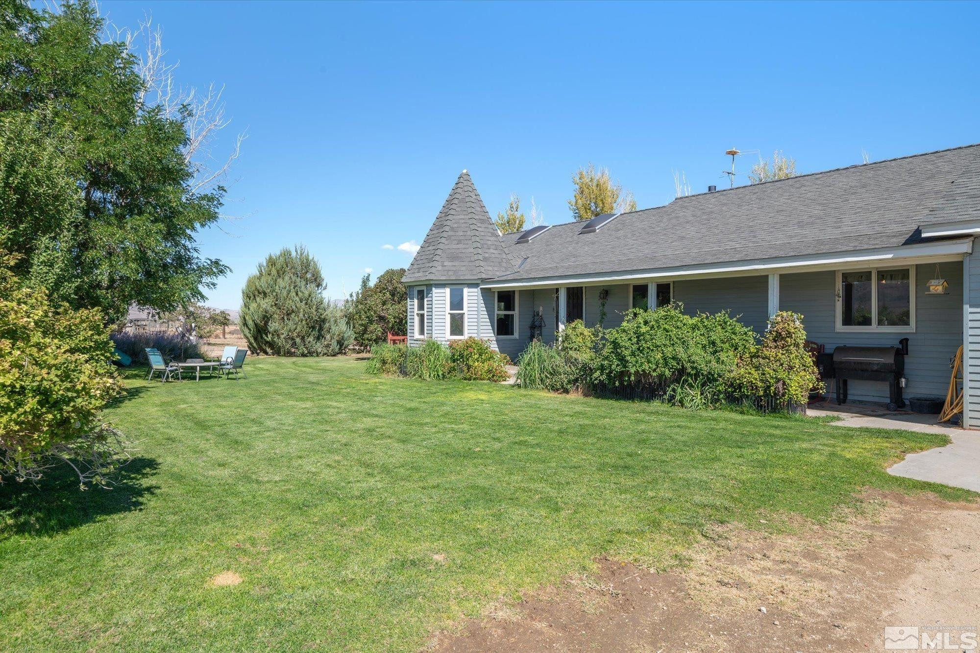 16300 Pyramid Way Reno, NV 89510 - Photo 12 of 36 a front view of a house with a garden
