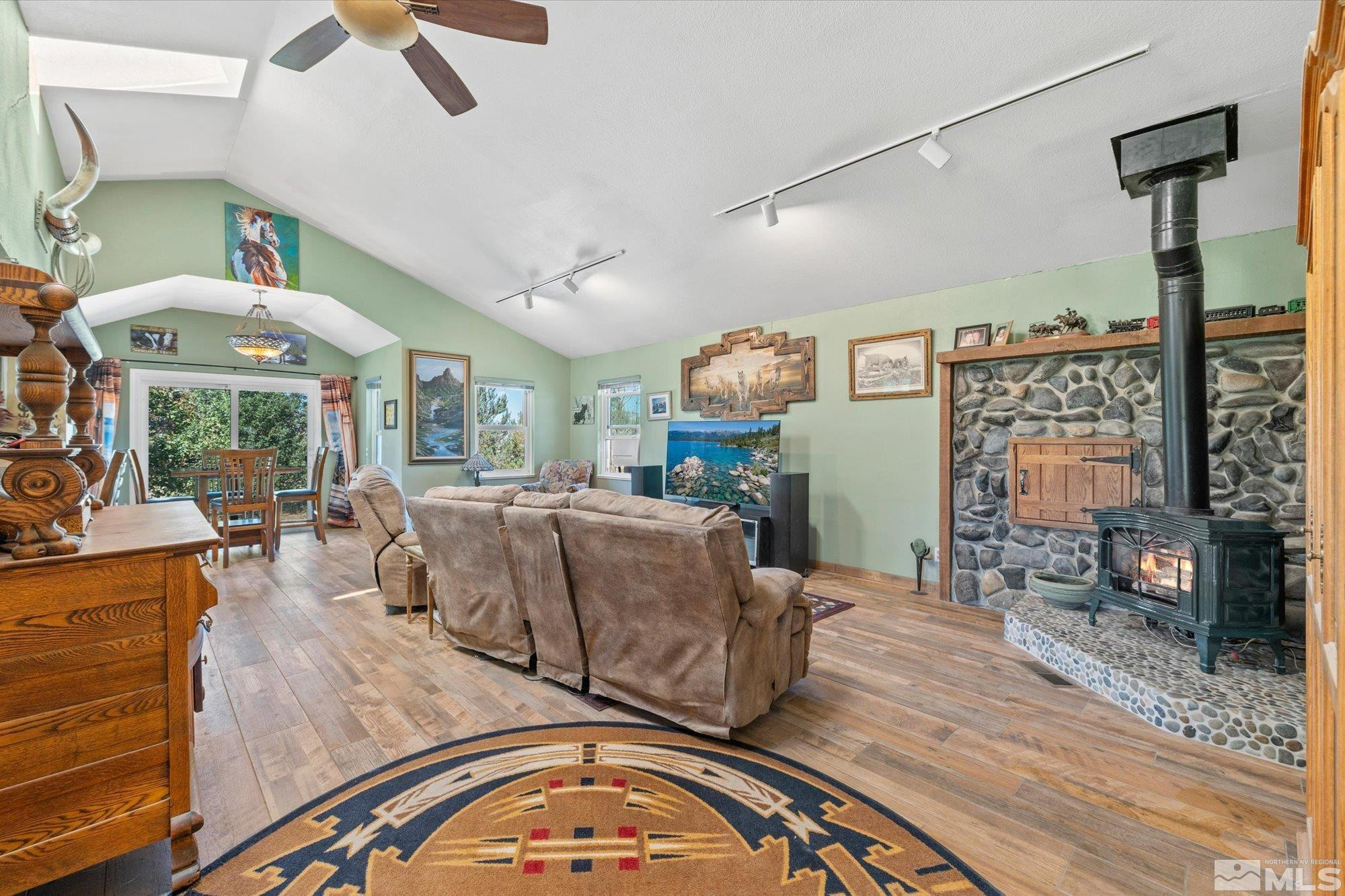 16300 Pyramid Way Reno, NV 89510 - Photo 15 of 36 a living room with furniture and a flat screen tv