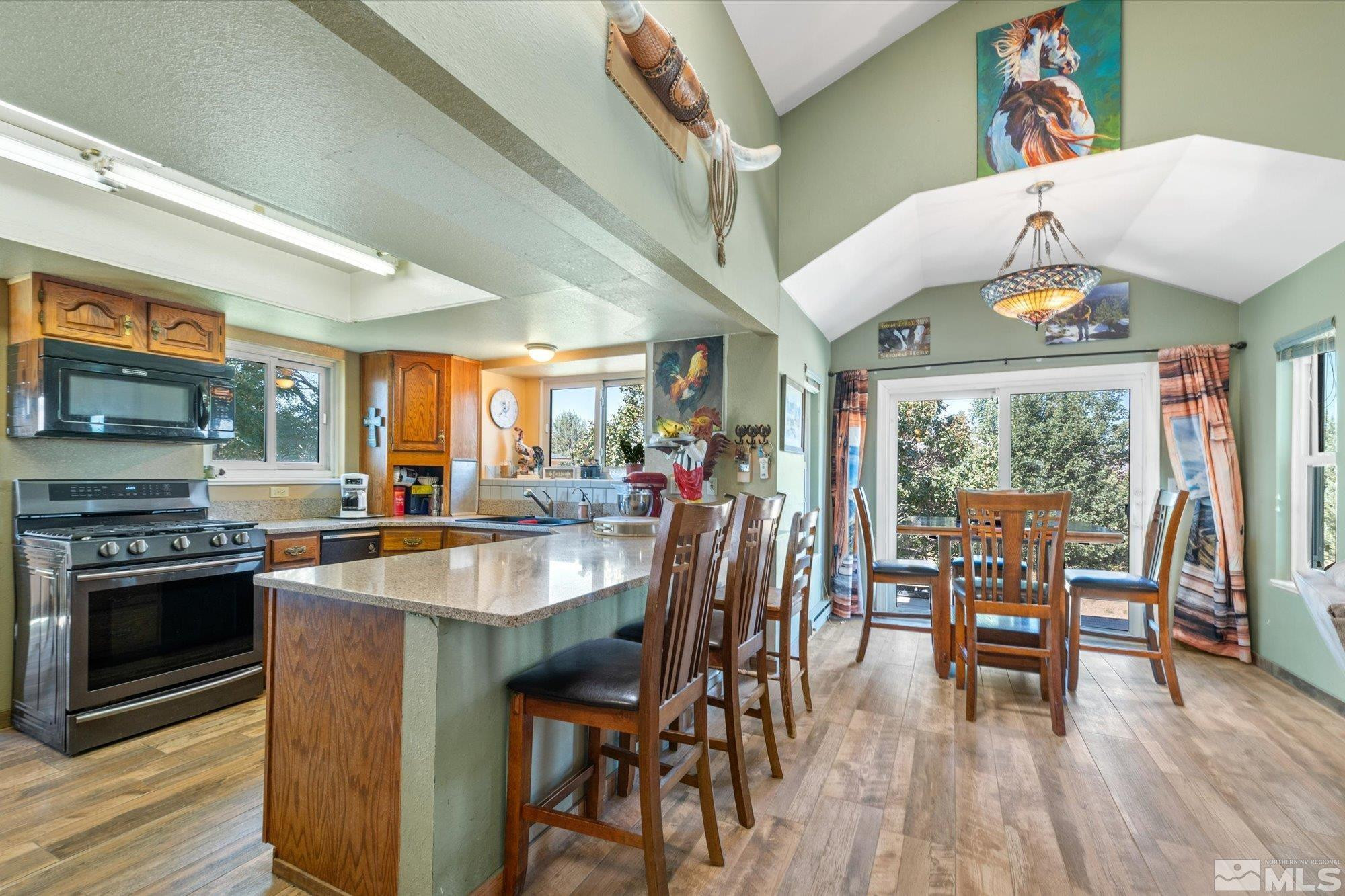 16300 Pyramid Way Reno, NV 89510 - Photo 17 of 36 a dining table with chairs and wooden floor