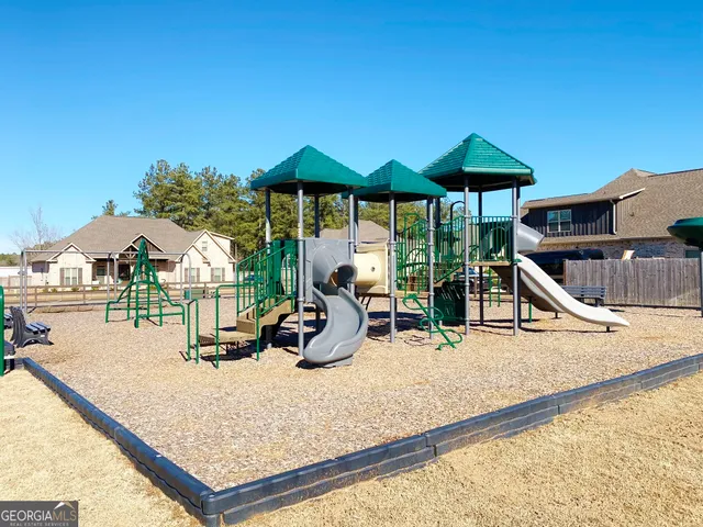 a view of swimming pool with sitting area