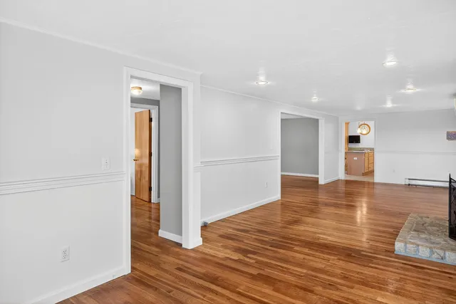 a kitchen with a table chairs sink and cabinets