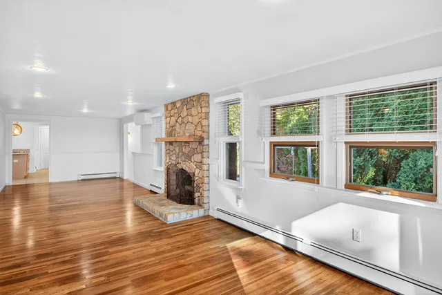 a kitchen with stainless steel appliances granite countertop a sink stove and wooden cabinets