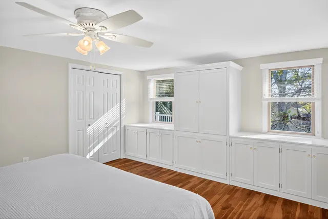 an aerial view of a house with a yard and lake view