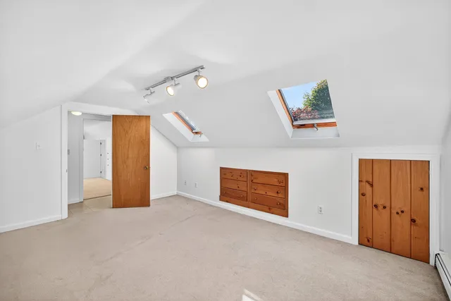 an aerial view of a houses with a yard