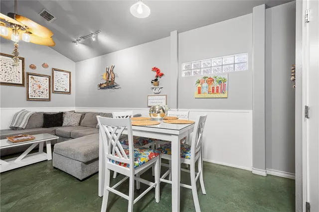 a spacious bedroom with a bed and a couch