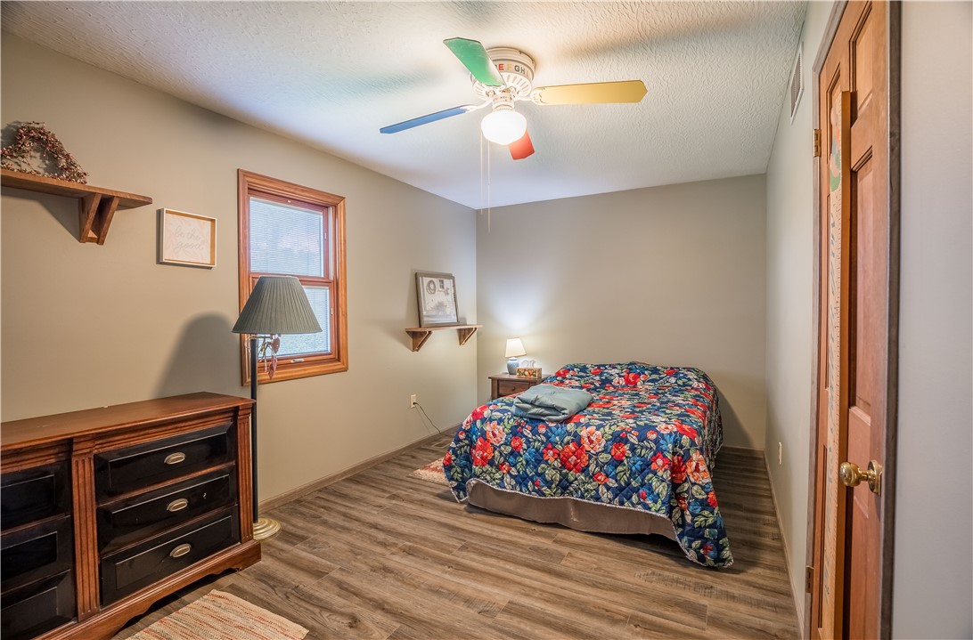 1319 Perry Road Cable, OH 43009 - Photo 21 of 44 This cozy bedroom features durable flooring and ample natural light, perfect for restful living.