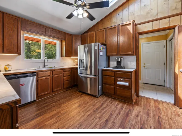 a view of living room kitchen with stainless steel appliances granite countertop counter top space