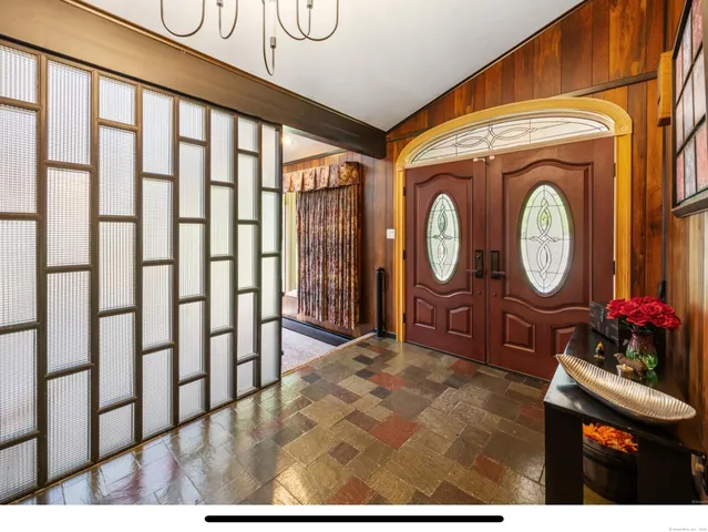 a bathroom with a sink a toilet and a window