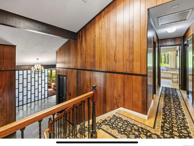 a bedroom with furniture and large window