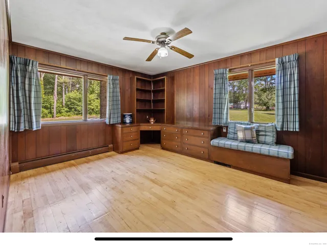 a bathroom with a sink a light fixture and a shower