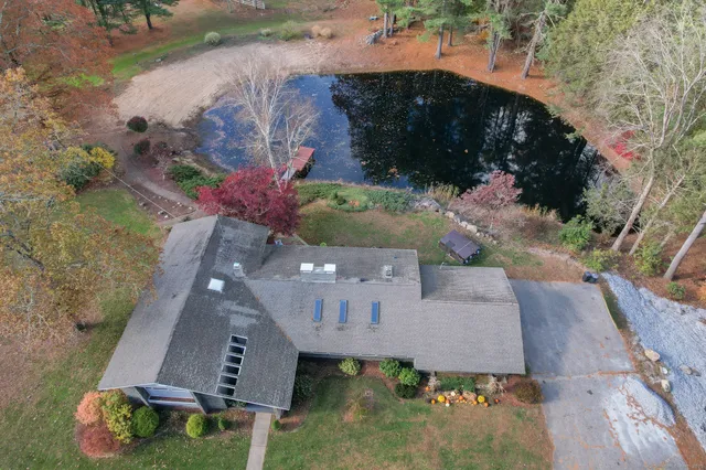 an aerial view of a houses with yard