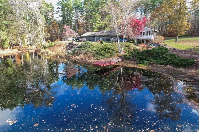 a view of a pool with a yard