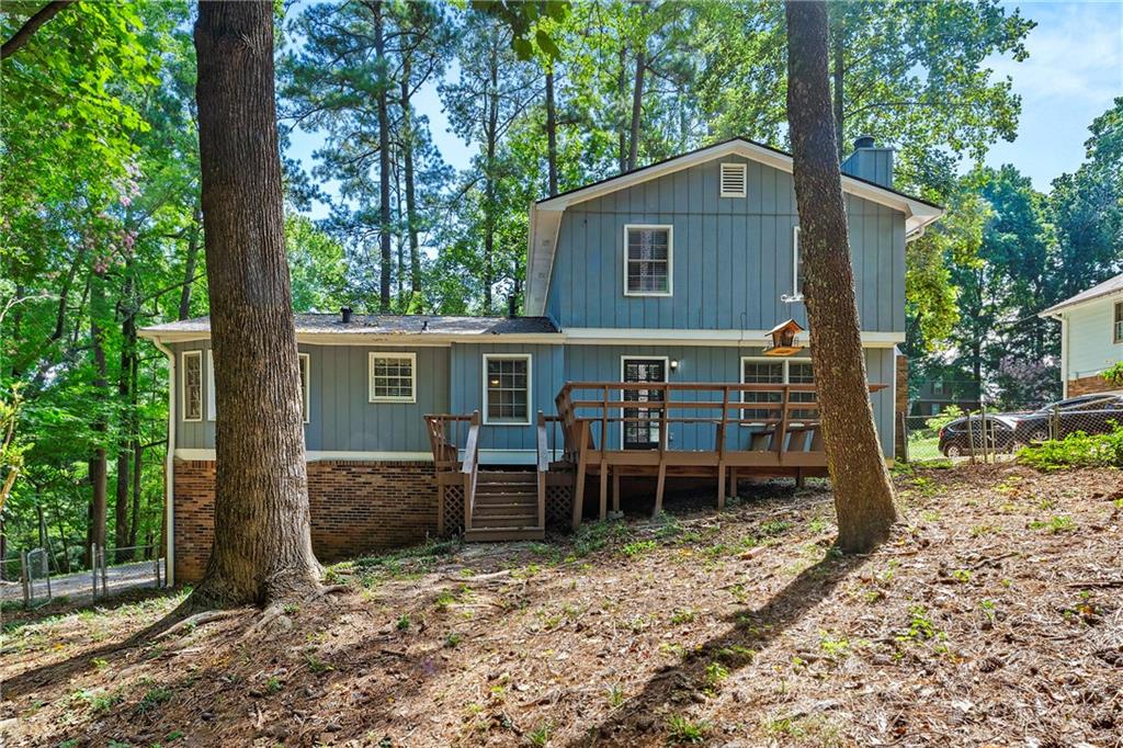 215 Hauteur Place Southwest Lilburn, GA 30047 - Photo 12 of 12 a view of house with a outdoor space