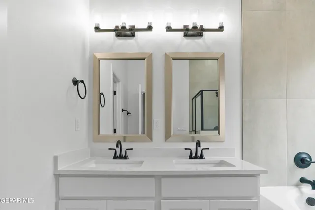 a bathroom with a sink and a mirror