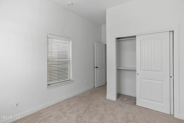 a view of empty room with windows