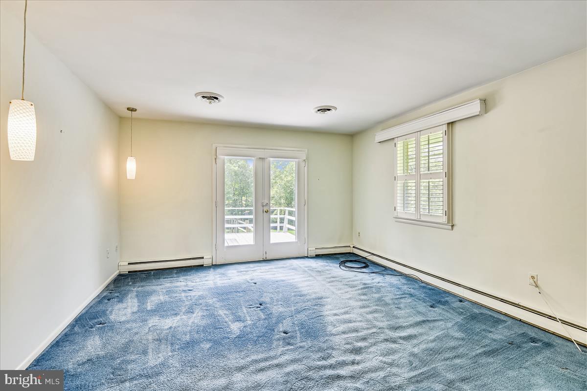 12496 Hall Shop Road Fulton, MD 20759 - Photo 53 of 91 Guest bedroom suite with doors to deck