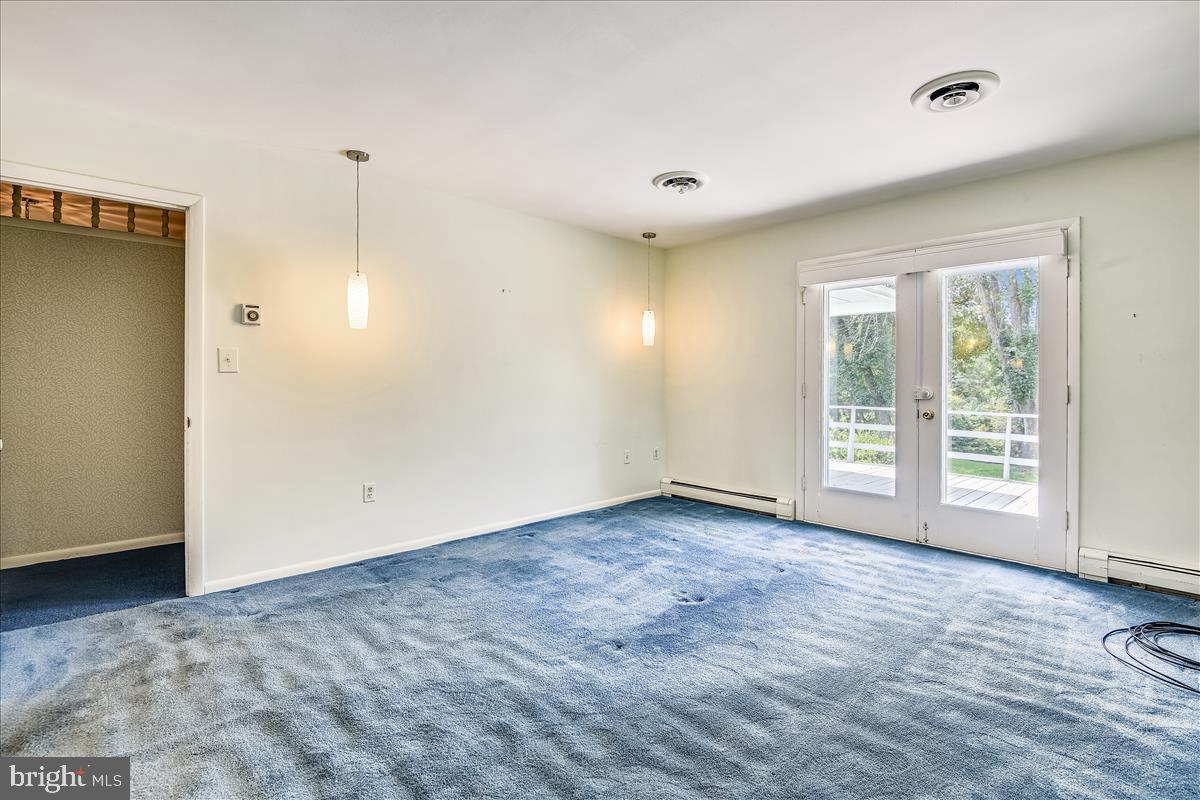12496 Hall Shop Road Fulton, MD 20759 - Photo 54 of 91 Guest bedroom suite with doors to deck