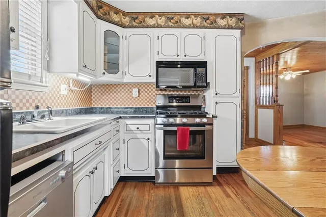 a room with a dresser and a window