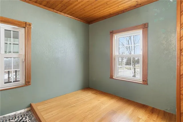 a bedroom with a bed lamp and furniture