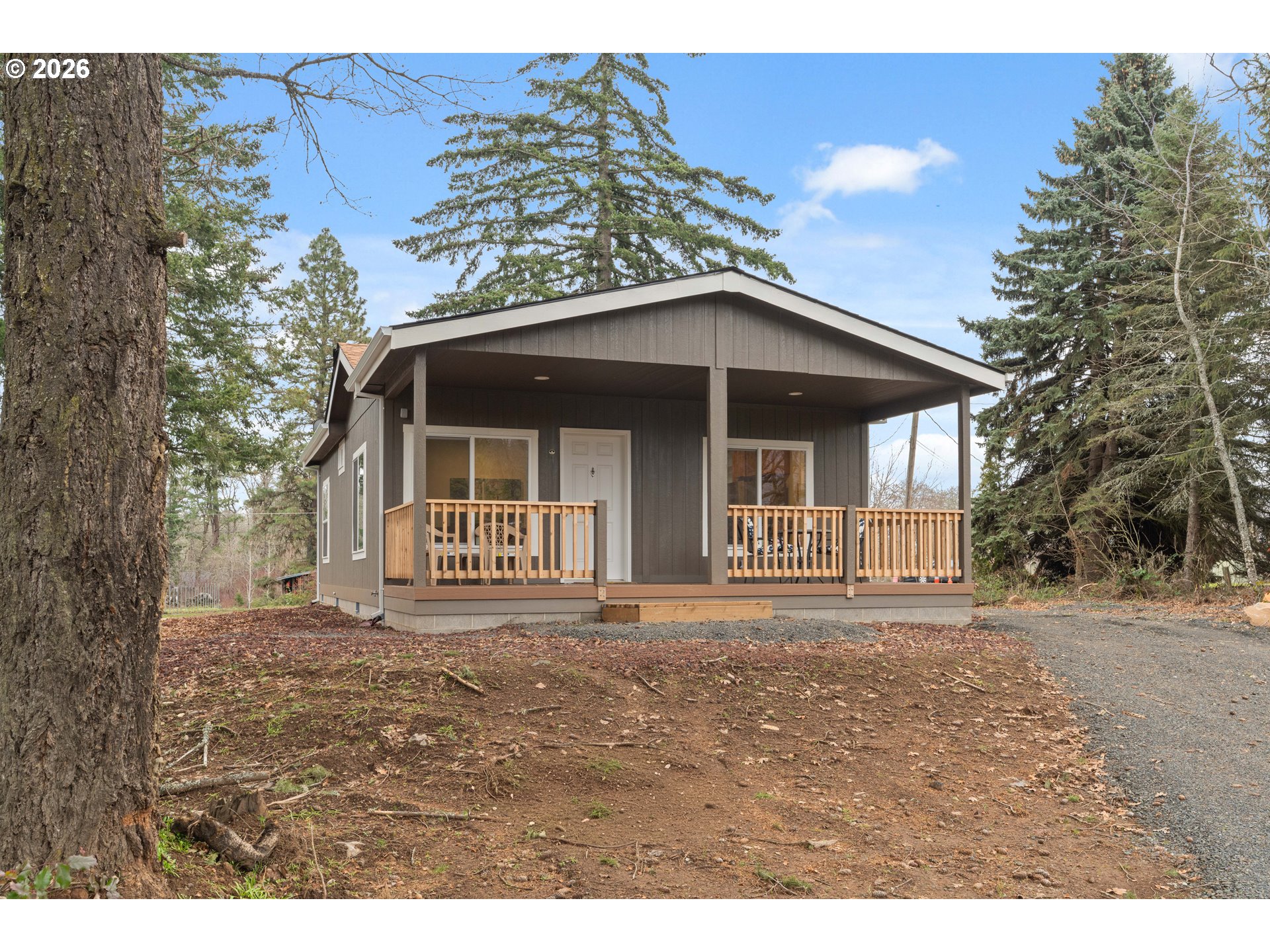 1390 Rockford Road Hood River, OR 97031 - Photo 2 of 14 a front view of a house with a garden