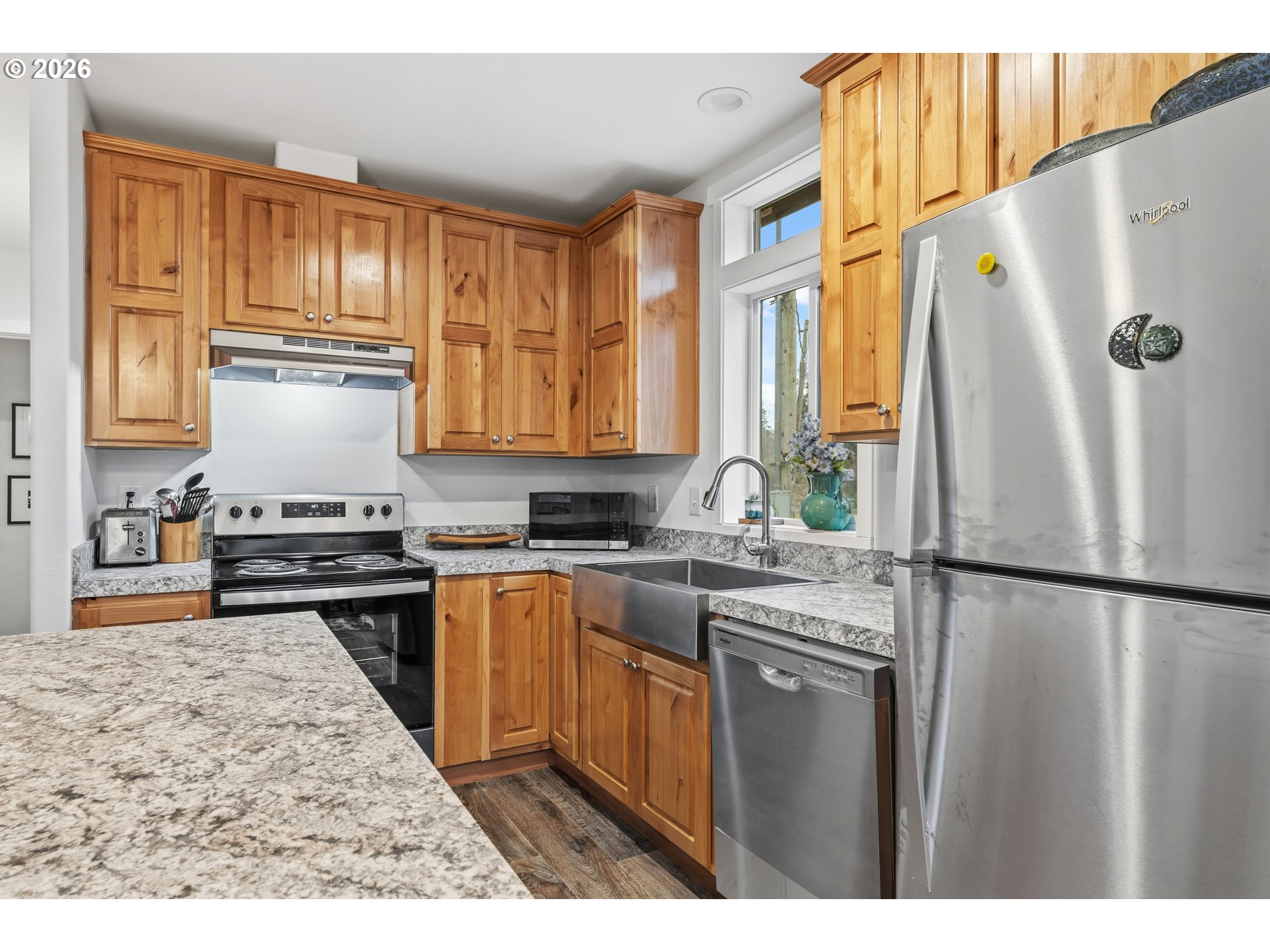 1390 Rockford Road Hood River, OR 97031 - Photo 5 of 14 a kitchen with a refrigerator a stove a sink and a cabinets