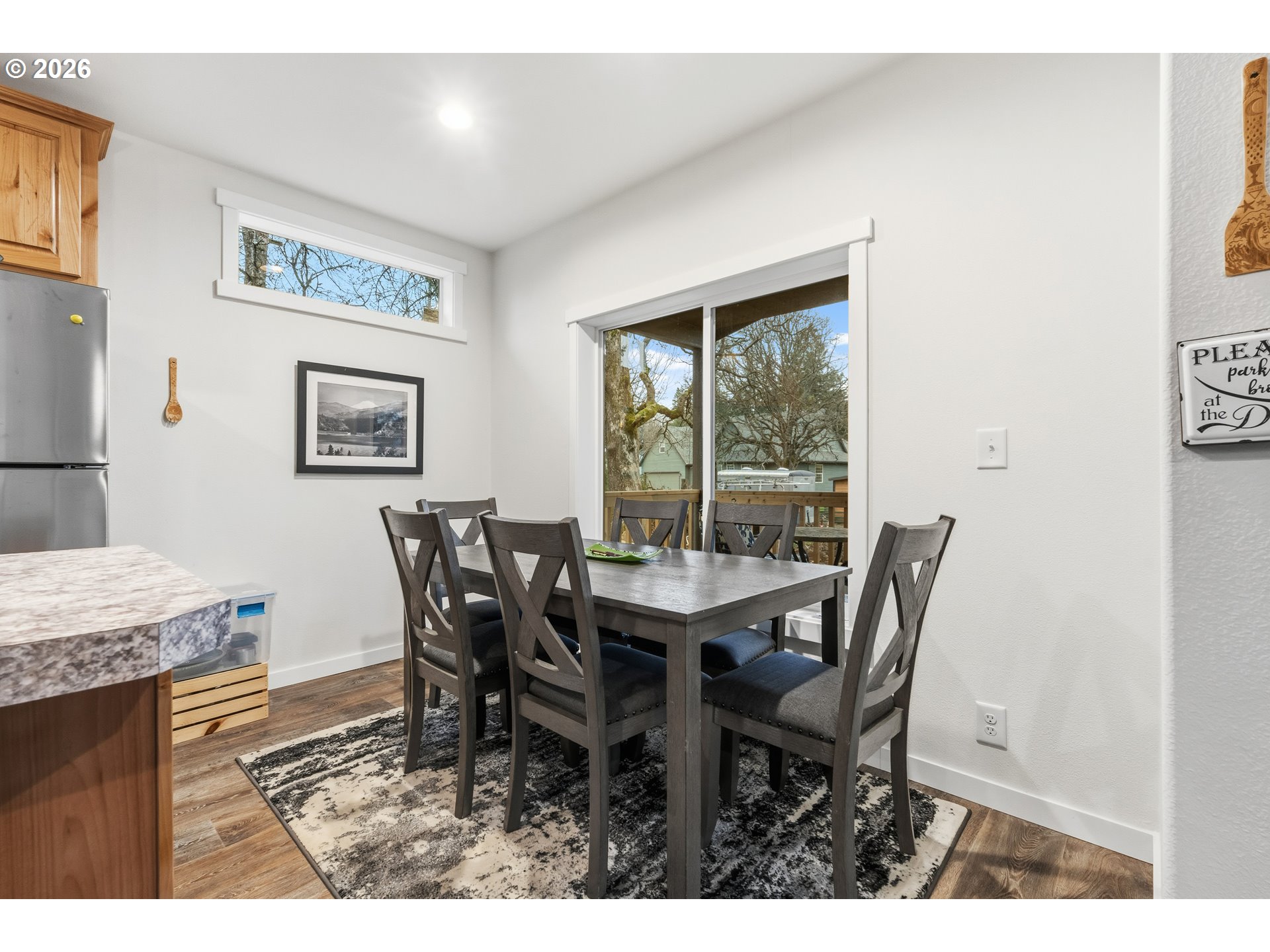 1390 Rockford Road Hood River, OR 97031 - Photo 6 of 14 a view of a dining room with furniture and a window