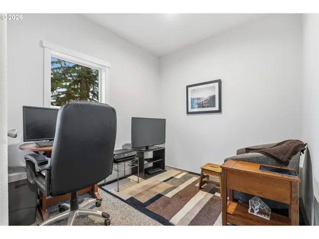 a workspace with furniture and a window