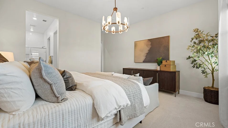 1355 Gavilan Ridge Rancho Mission Viejo, CA 92694 - Photo 10 of 26 a bedroom with a bed and a chandelier