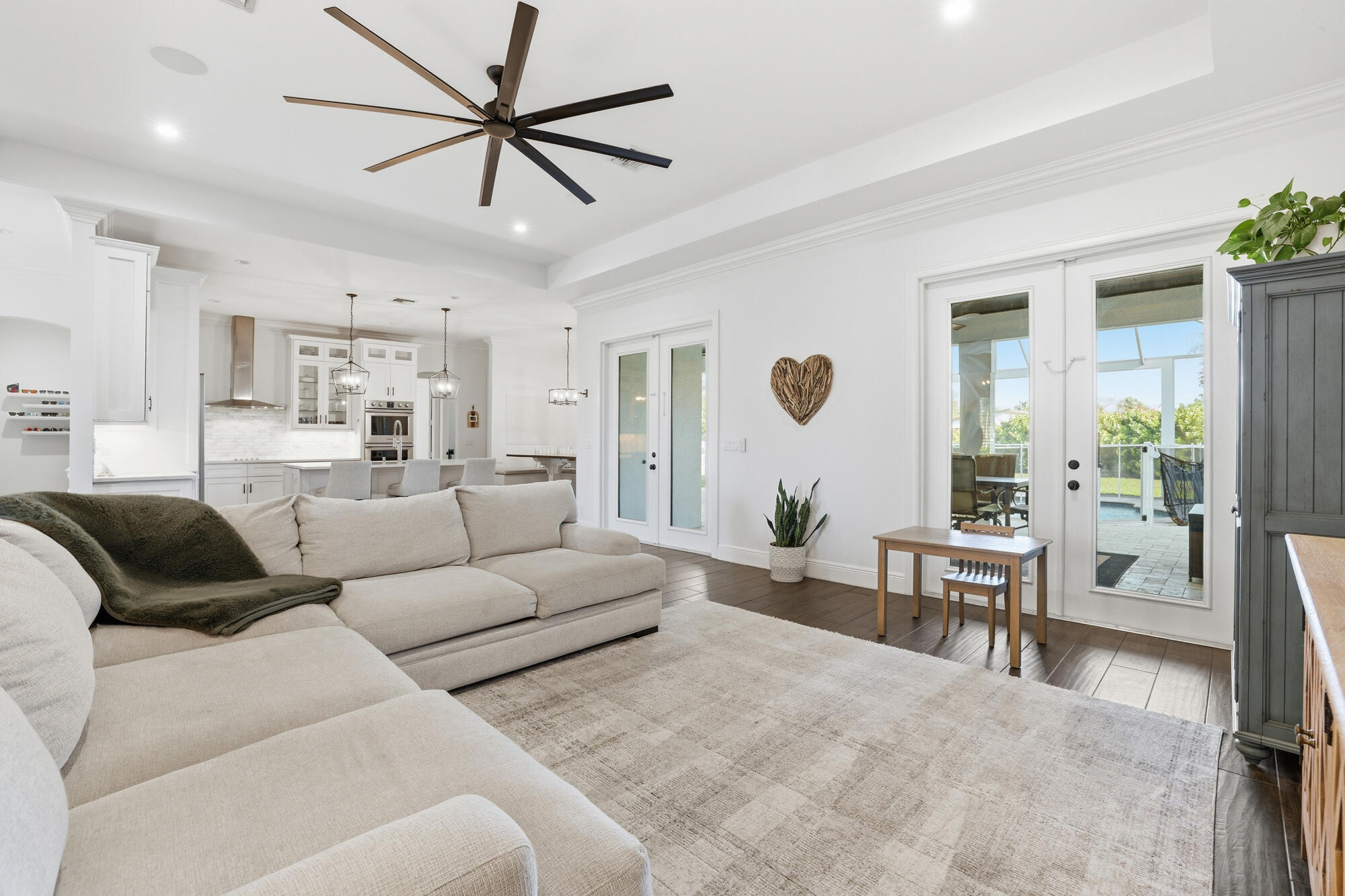 9301 154th Road North Jupiter, FL 33478 - Photo 12 of 39 a living room with furniture and a large window