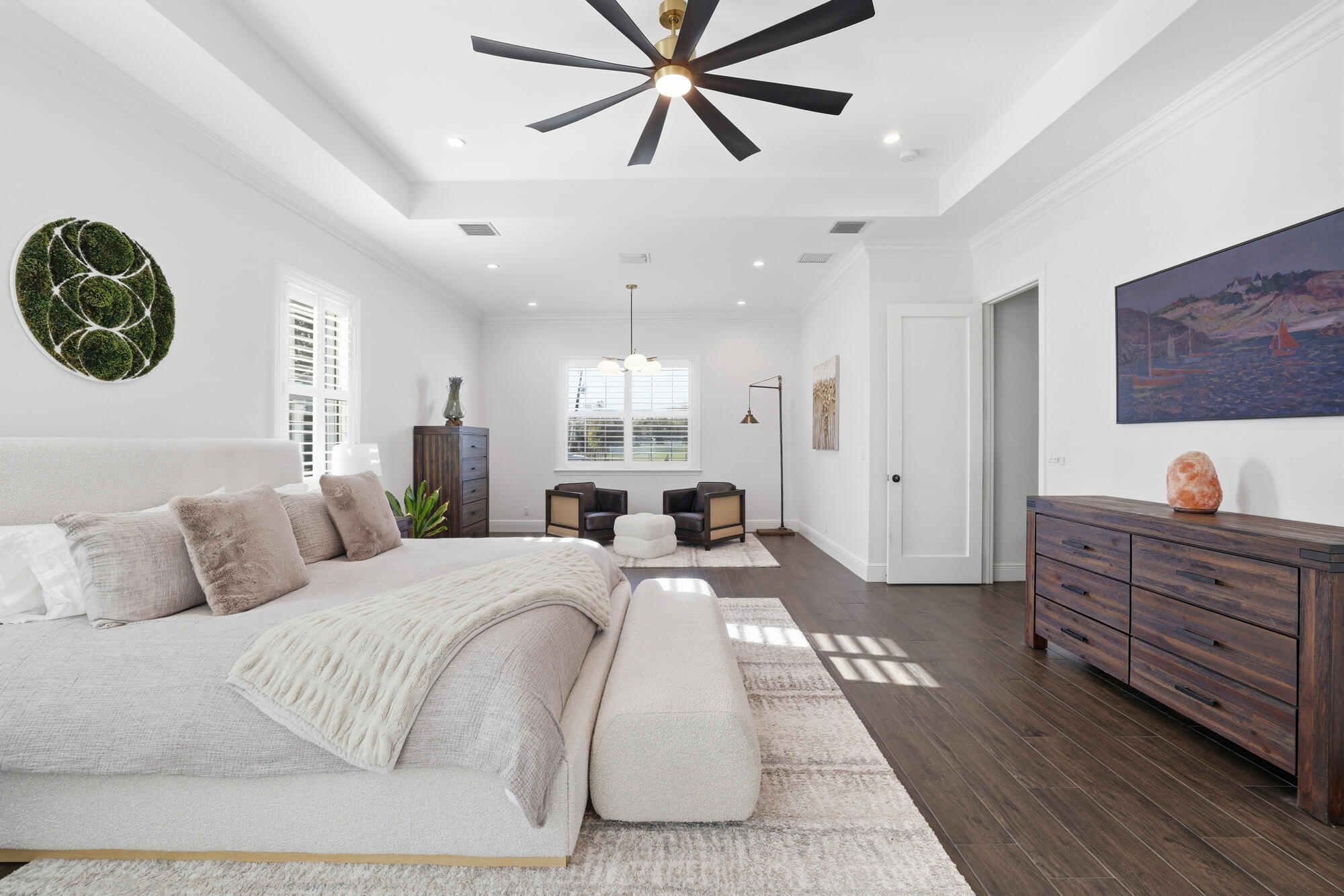 9301 154th Road North Jupiter, FL 33478 - Photo 14 of 39 a bedroom with a large bed and a chandelier
