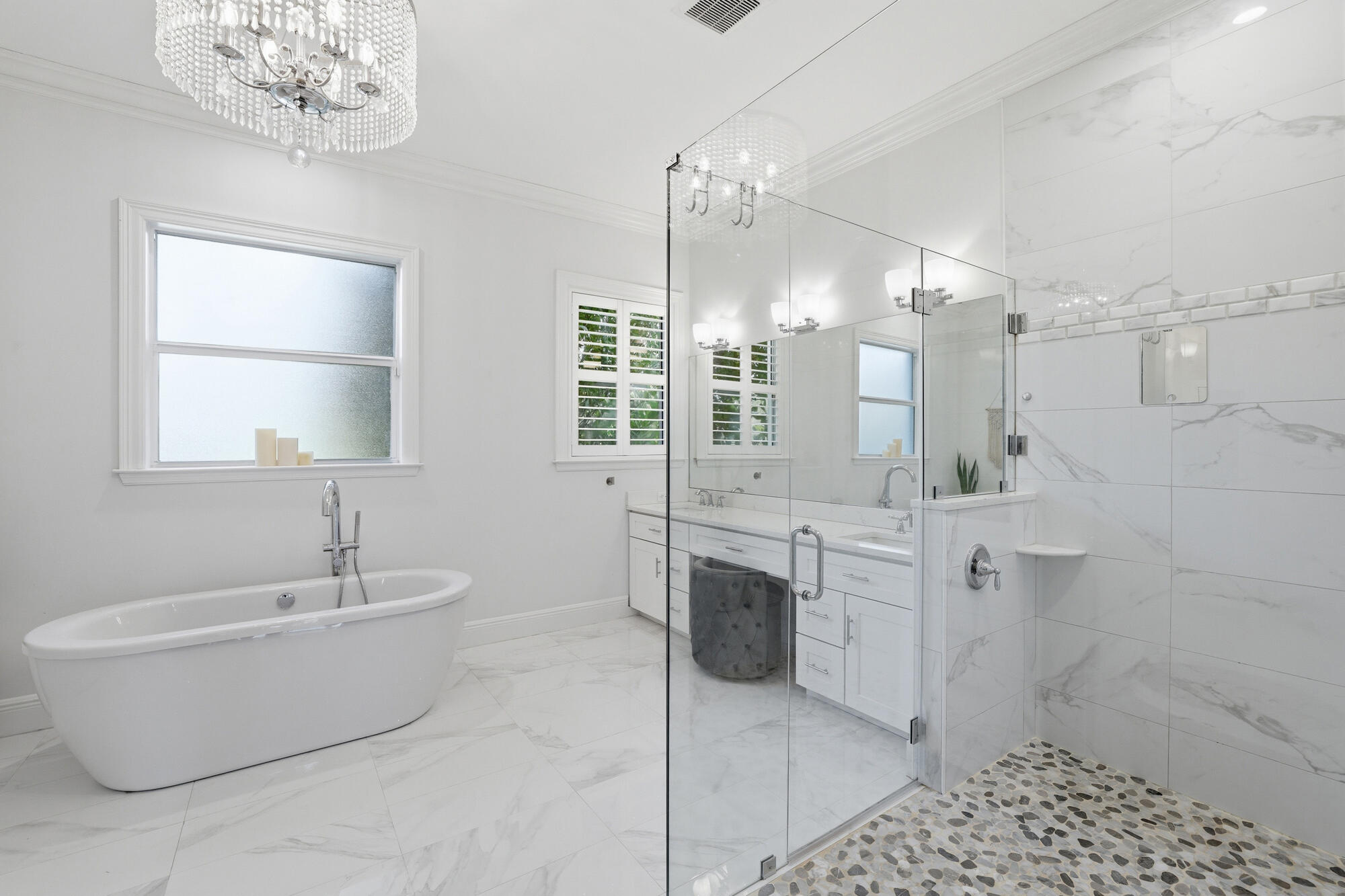 9301 154th Road North Jupiter, FL 33478 - Photo 16 of 39 a bathroom with a tub sink and mirror
