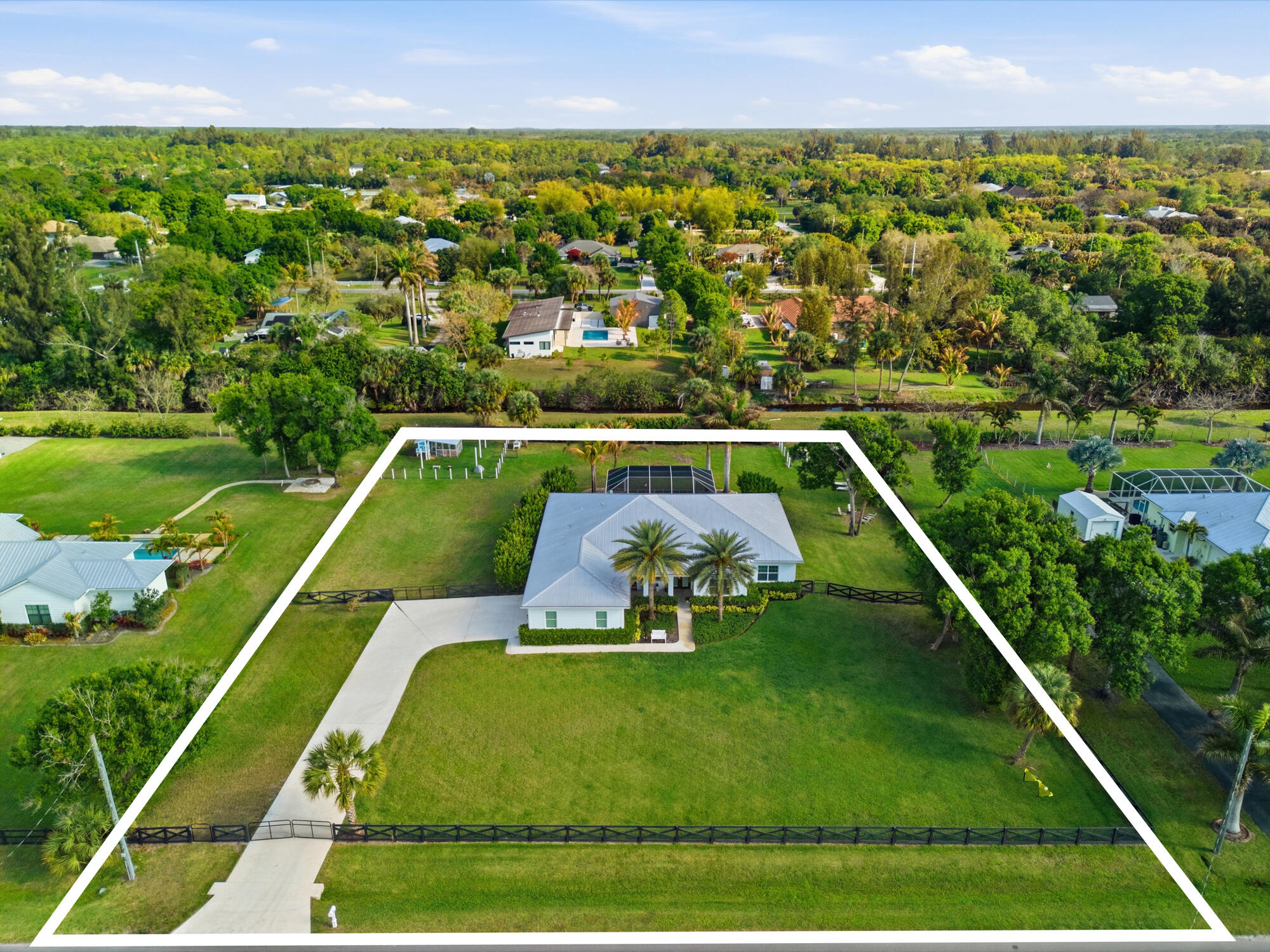 9301 154th Road North Jupiter, FL 33478 - Photo 2 of 39 a view of a tennis court