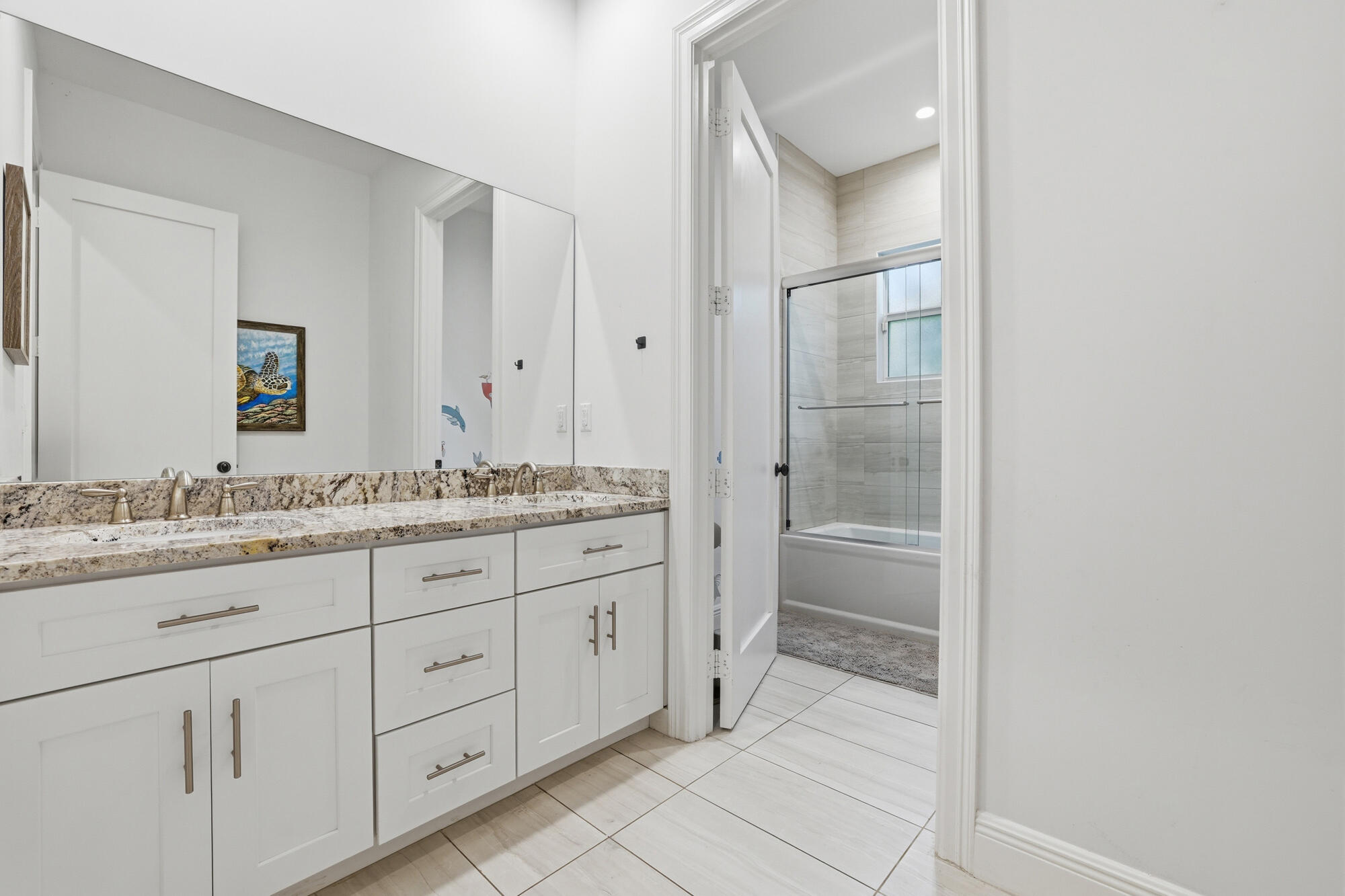 9301 154th Road North Jupiter, FL 33478 - Photo 21 of 39 a bathroom with a granite countertop sink and a mirror