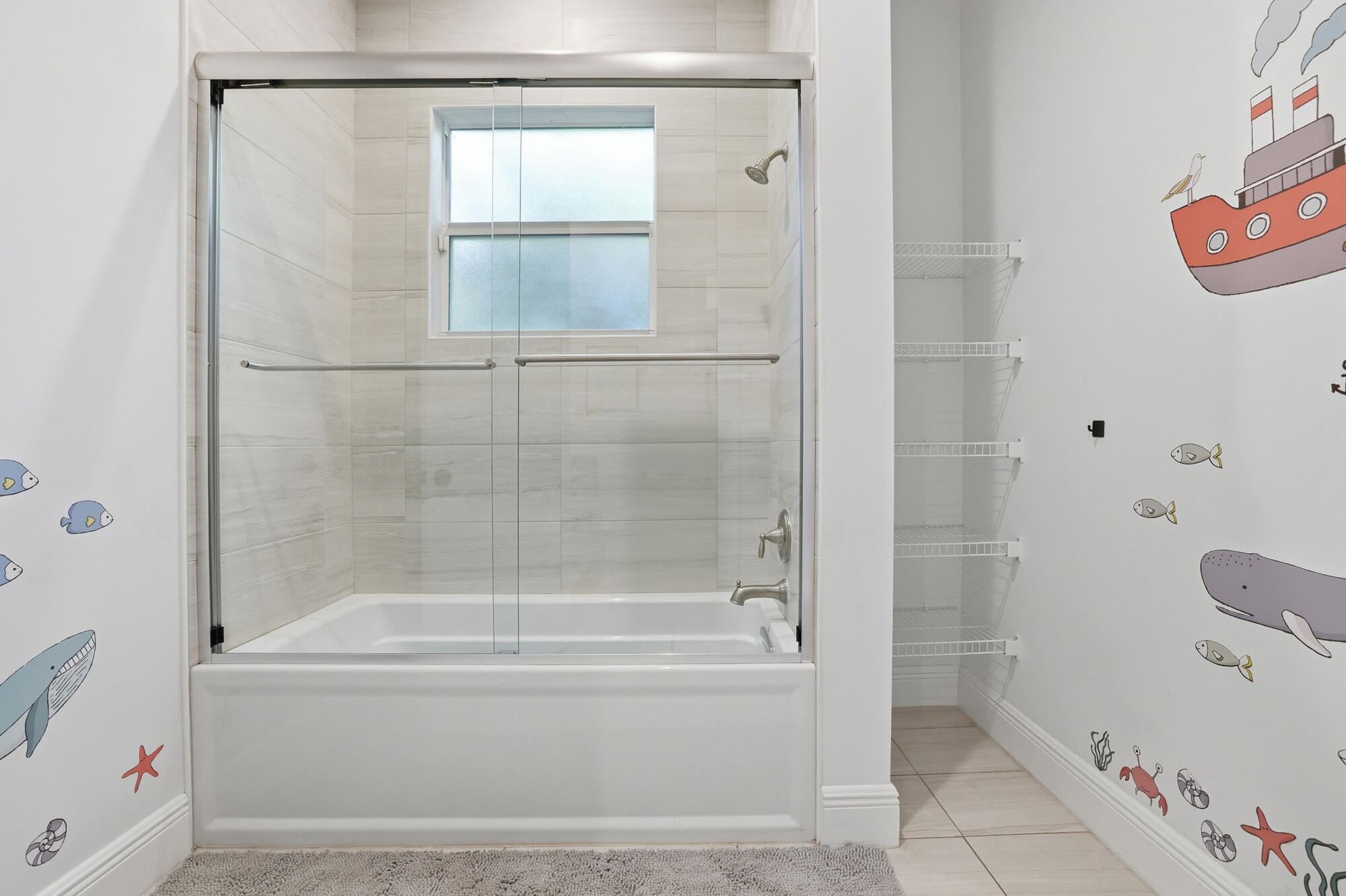 9301 154th Road North Jupiter, FL 33478 - Photo 22 of 39 a bathroom with a bathtub and a shower